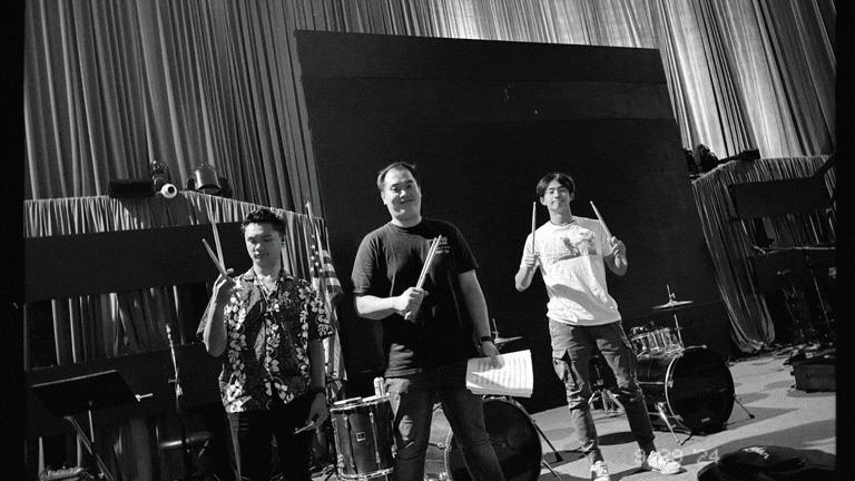 an abstract photo of a curved building with a blue sky in the background
