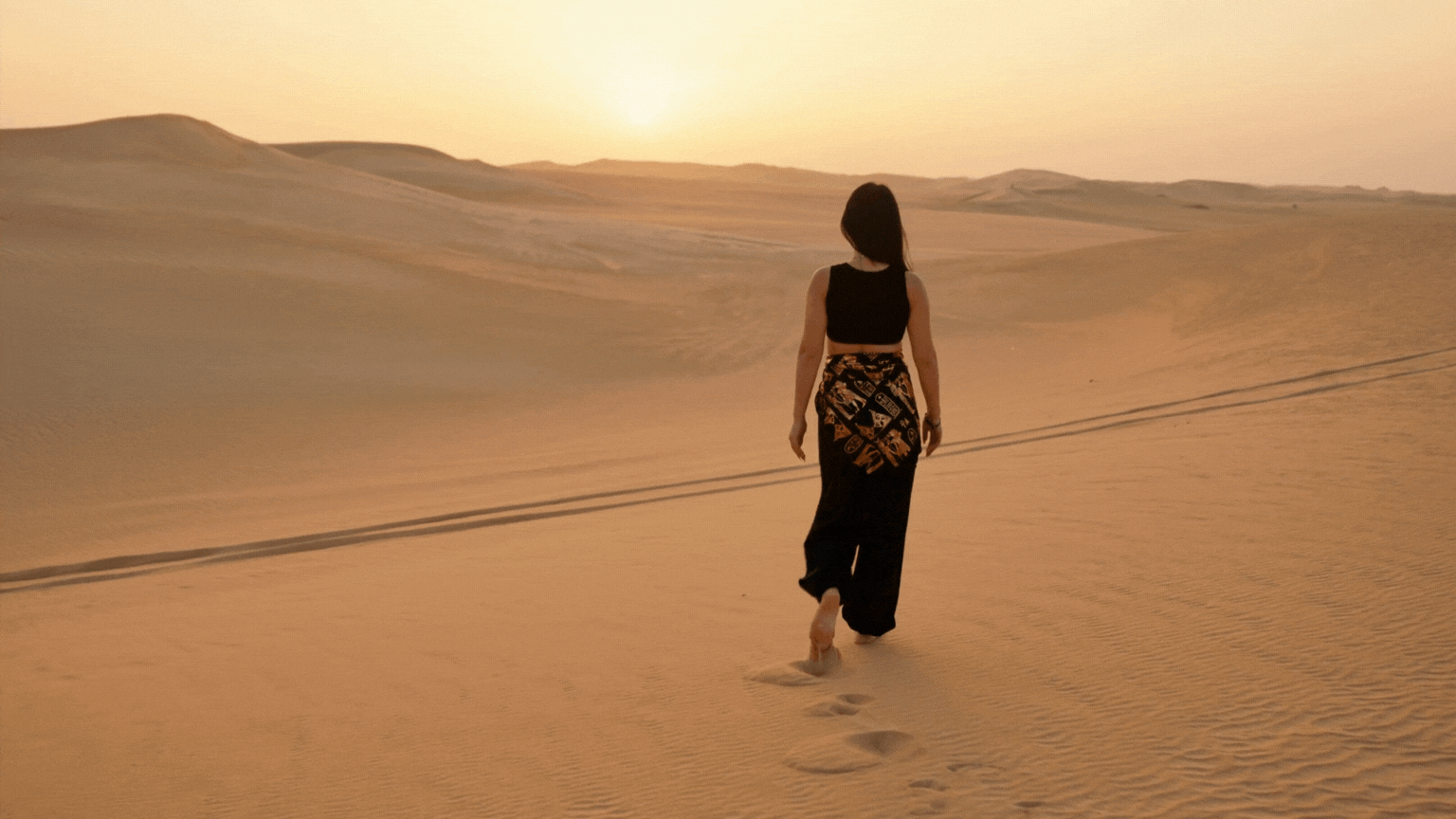 person walking in the desert