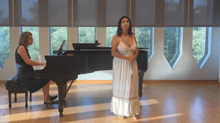 an abstract photo of a curved building with a blue sky in the background