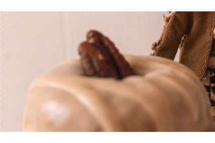 an abstract photo of a curved building with a blue sky in the background