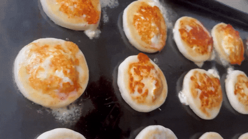 an abstract photo of a curved building with a blue sky in the background