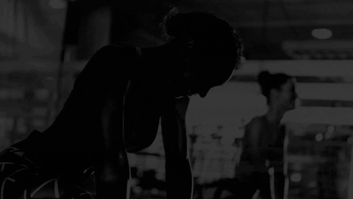 woman seriously performing gym exercise