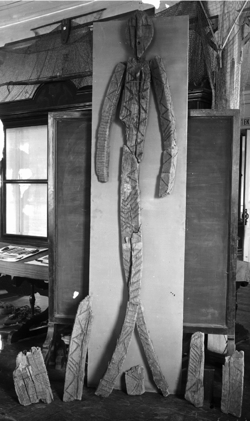 the worlds oldest wooden sculpture of a man standing in a room