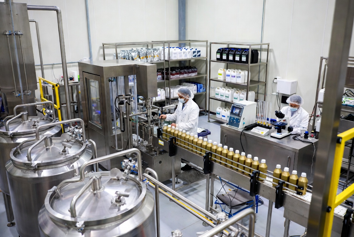 Modern lubricant manufacturing facility showing bottling and quality control operations for startups