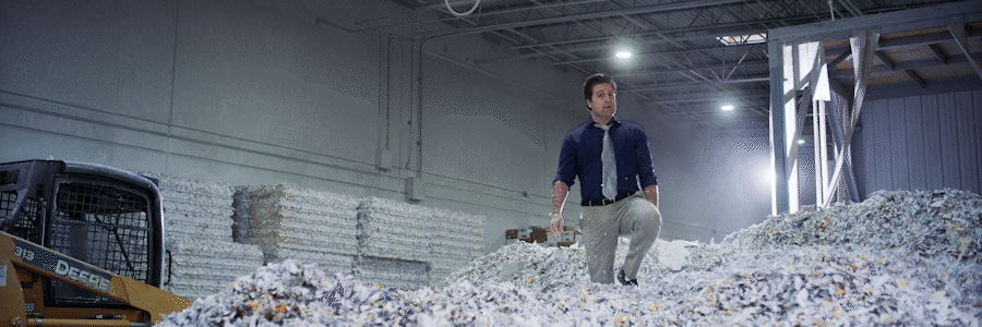 an abstract photo of a curved building with a blue sky in the background