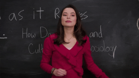 Teacher GIF - Walking in front of class in slow motion while hair bouncing