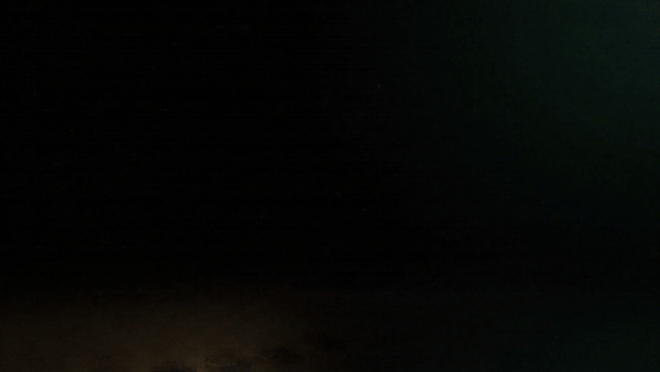 a close up of a black and brown abstract painting