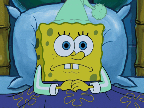 Spongebob Squarepants, wearing a green nightcap and pajamas, lies in bed with a worried expression, unable to sleep.