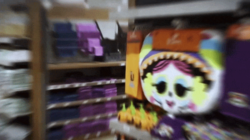 an abstract photo of a curved building with a blue sky in the background