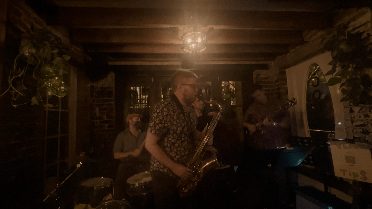 GIF - a jazz quarter playing in a dark bar