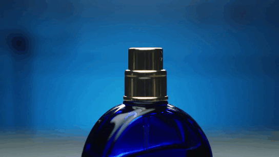 an abstract photo of a curved building with a blue sky in the background