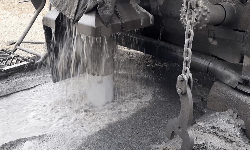 an abstract photo of a curved building with a blue sky in the background
