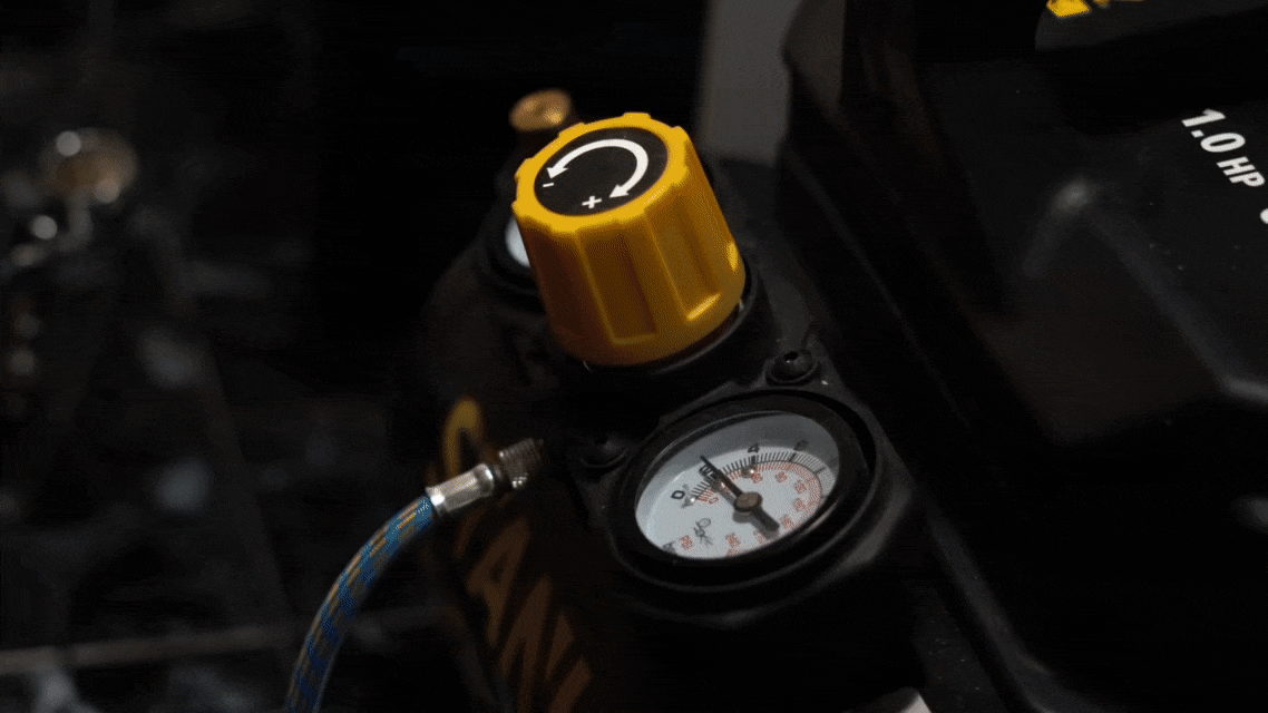 a green sculpture of a man's head on a table