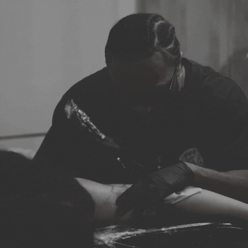 black and brown leather padded tub sofa