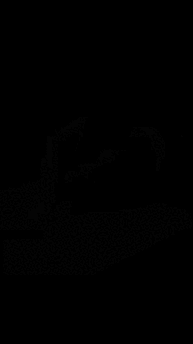 an abstract photo of a curved building with a blue sky in the background