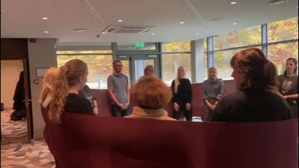 black and brown leather padded tub sofa