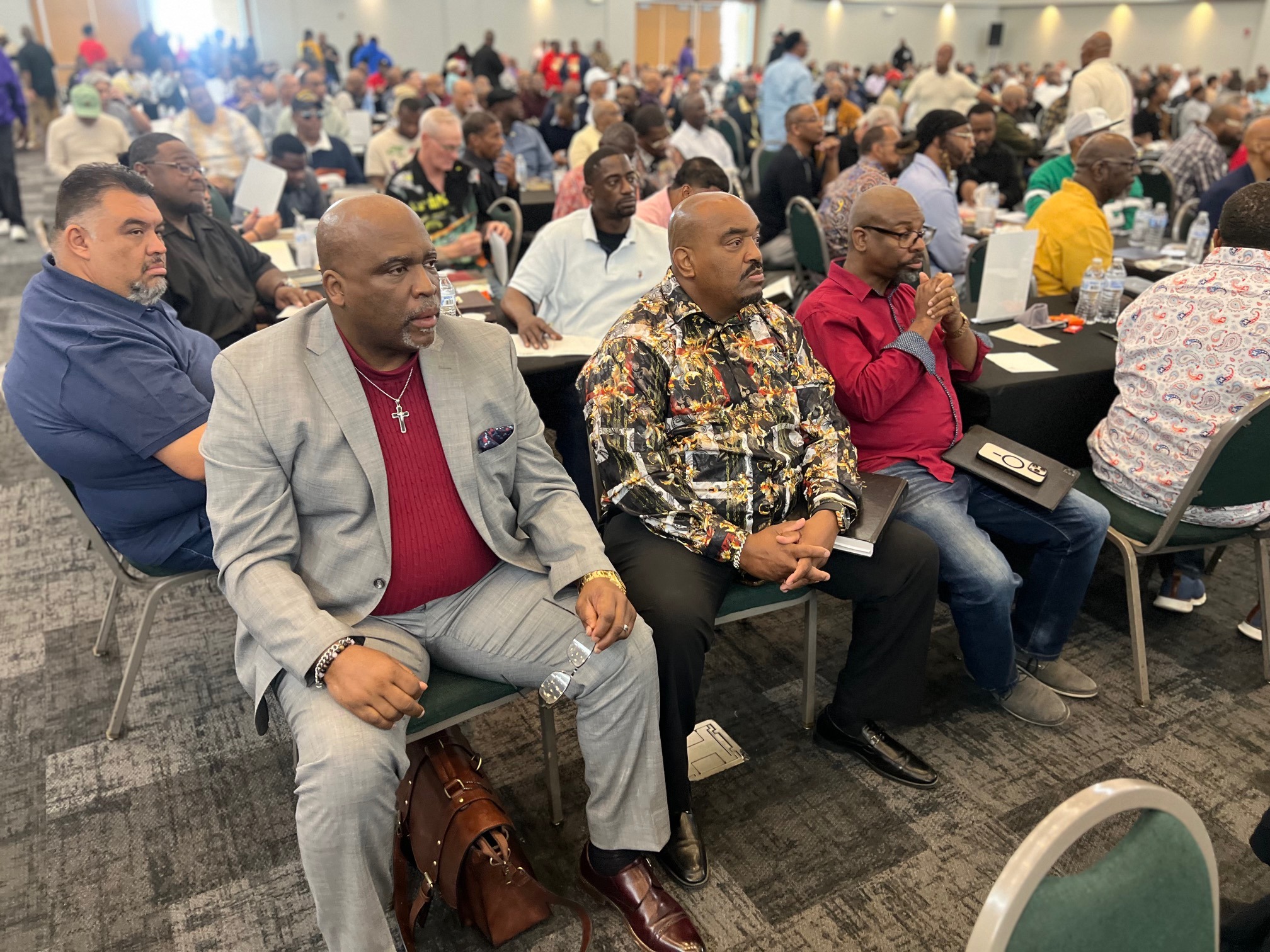 Attendees seated and listening attentively