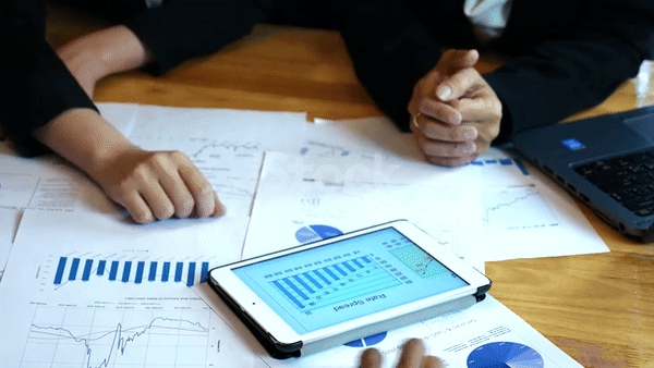 an abstract photo of a curved building with a blue sky in the background