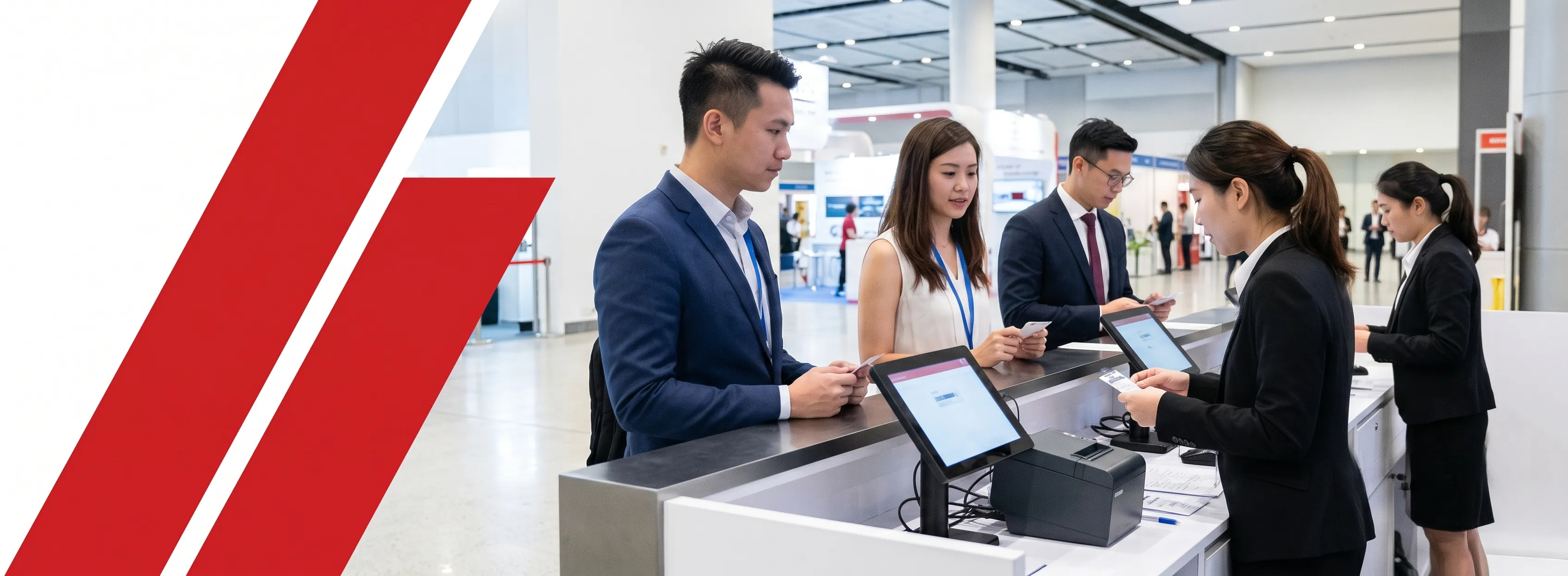 Attendees checking in at trade show registration desk with onsite registration system and badge printing equipment
