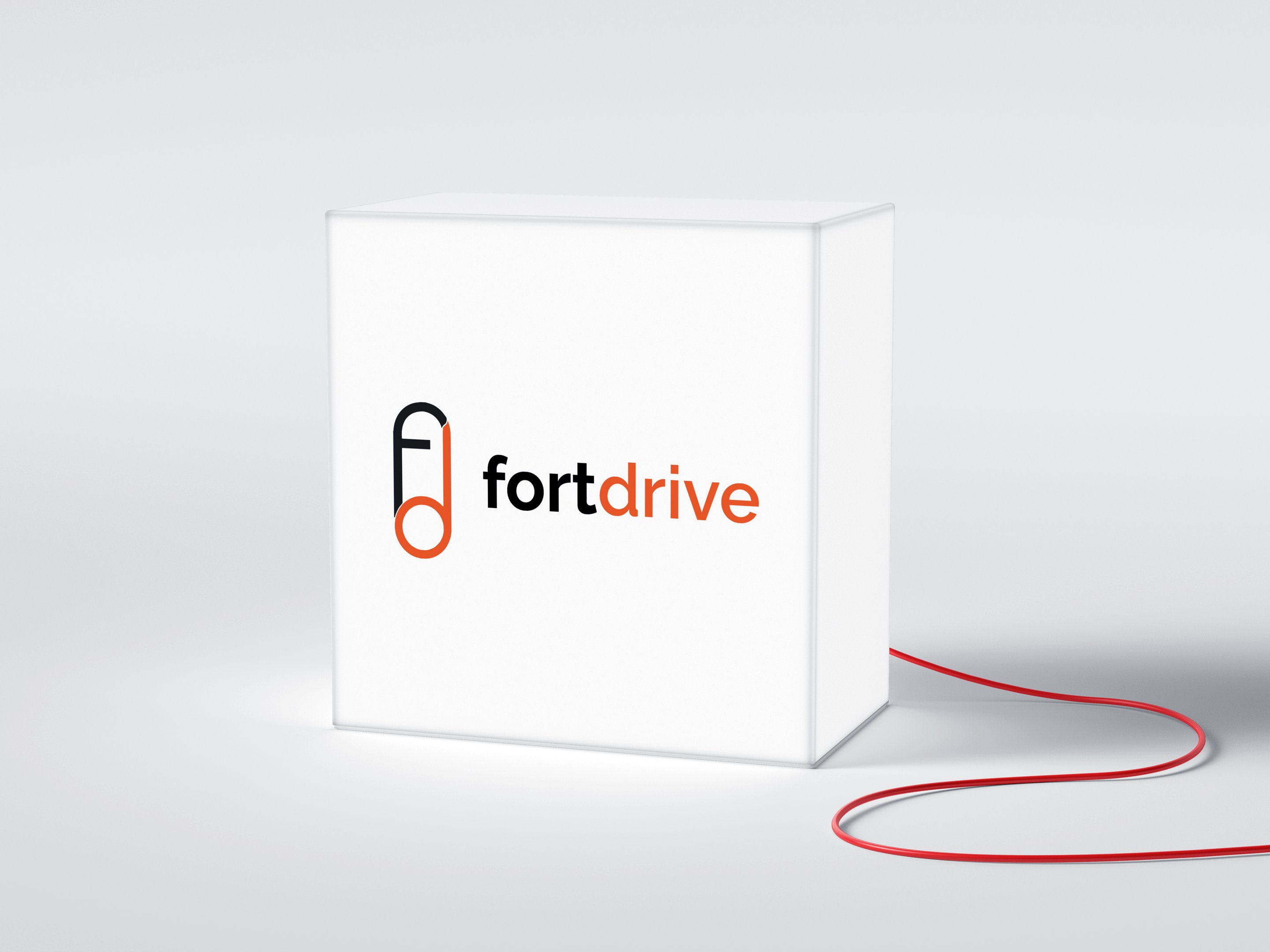 a white box  with Fortdrive's logo and a red cord corded to it