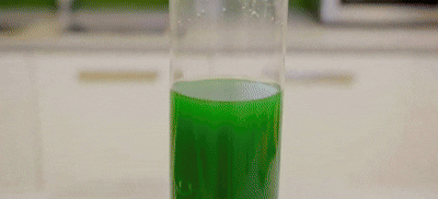 a close up of a red and green substance