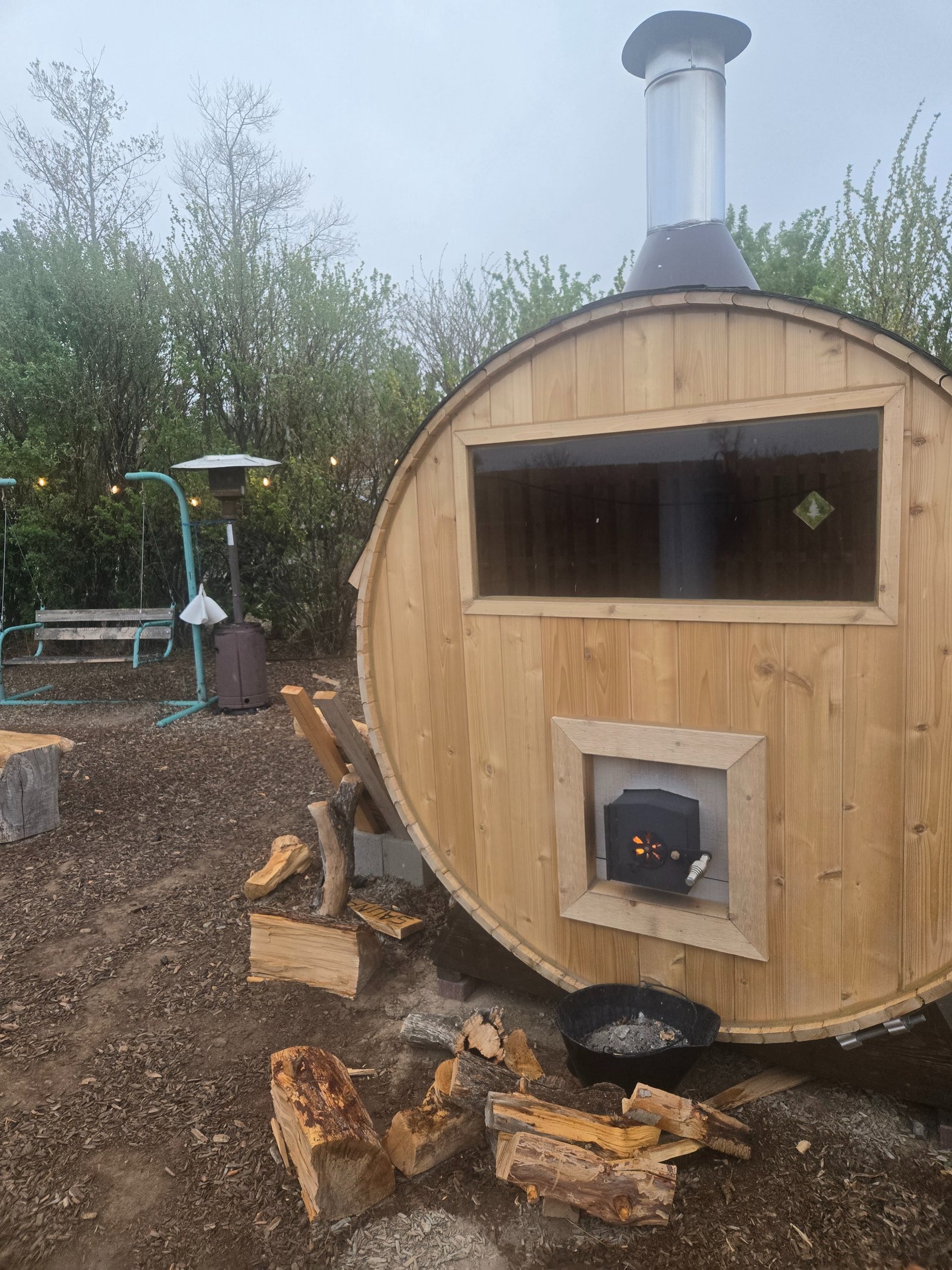 Wildland Gardens sauna being used with outdoor shower in the background