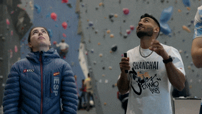 an abstract photo of a curved building with a blue sky in the background