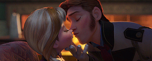 a couple of people kissing in a scene from tangled up