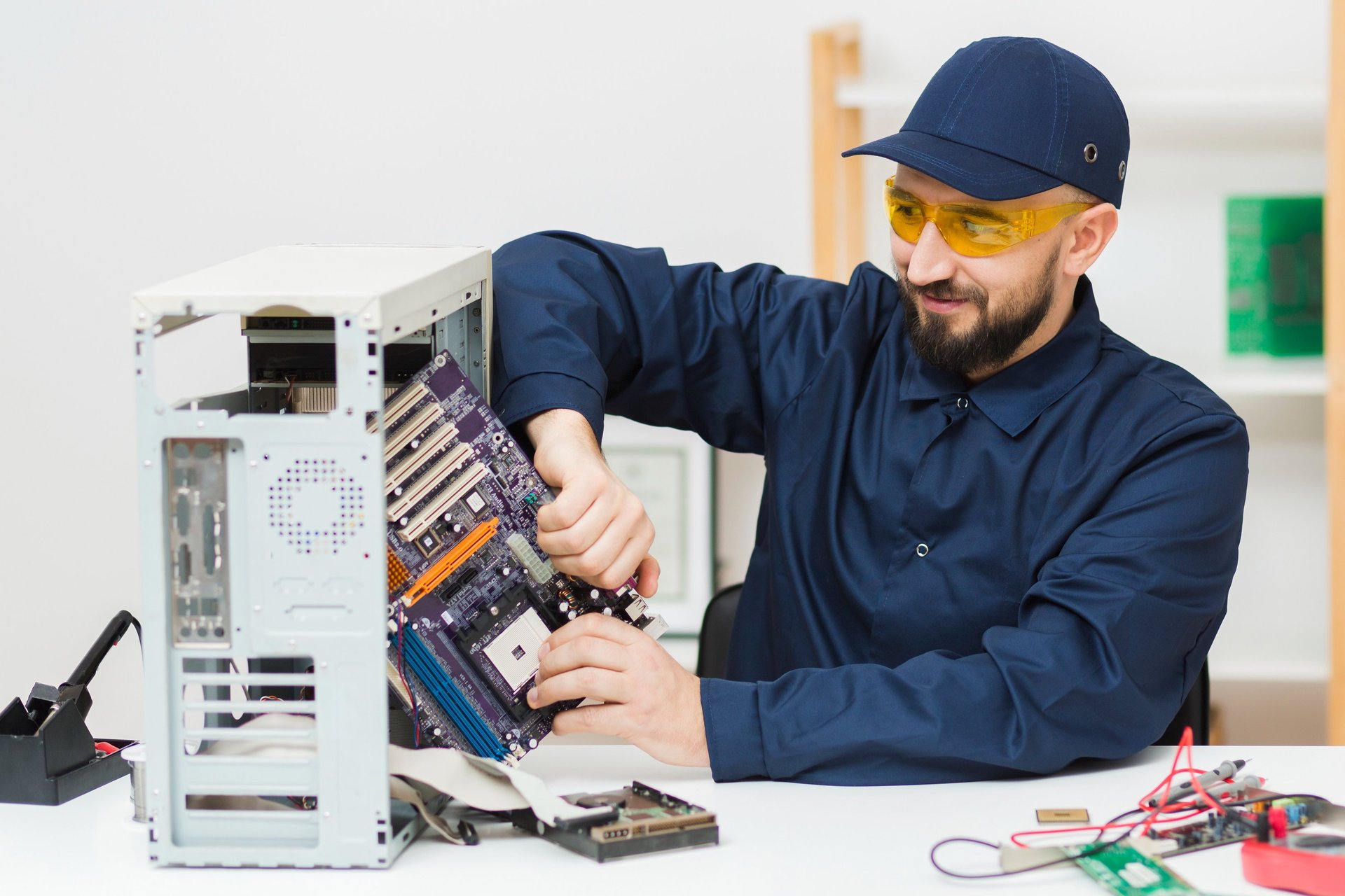 Computer technician repairing a desktop