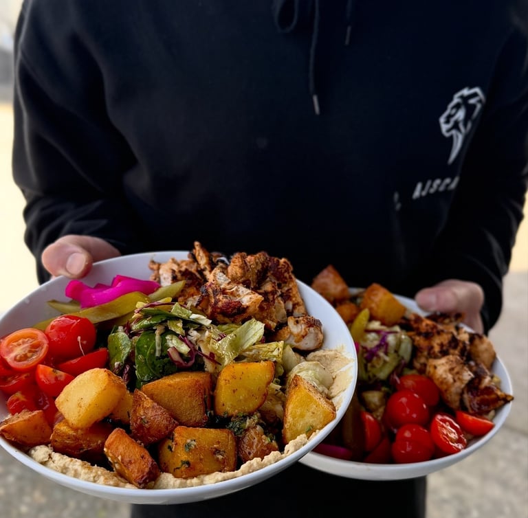 Beirut bowl with roasted potatoes, tomatoes and pickles