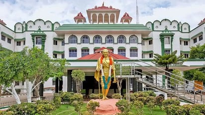 Madras high  court building in Tamil Nadu with Gandhi statue at entrance