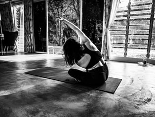 person practising breath-led movement to ease back pain