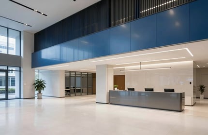 A minimalist corporate lobby in a North American / US tech hub. Sophisticated architecture, off-white floors, steel blue accents, high-end photography.