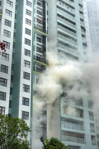 large apartment building on fire
