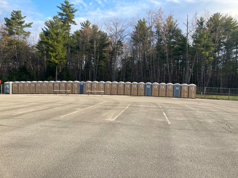 portable potties in a parking lot