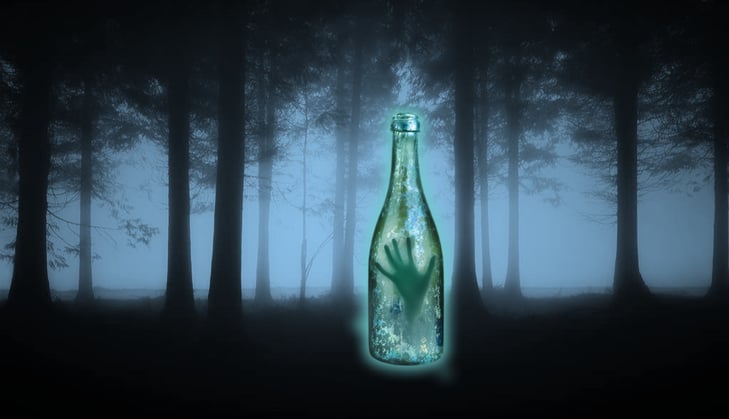 mysterious wine bottle with somone inside at a dark forest