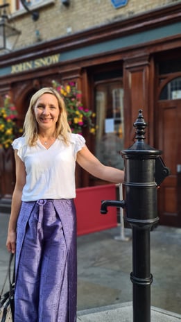 Dr Helena Seth-Smith standing at the John Snow water pump, London