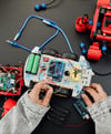a person holding a remote control car