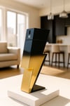 a gold lightning bolter sculpture on a table