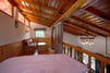 Superior Attic Room with sofa and table with bed partially visible