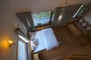 Superior Attic Bed Room with sofa and table, a birds eye view