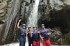 Bali rafting tour featuring scenic waterfall on Ayung River in Ubud