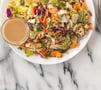 chicken-salad-and-sauce-on-white-plate