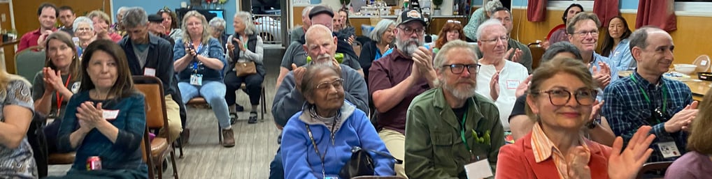 Audience applauding after a talk at a chapter meeting