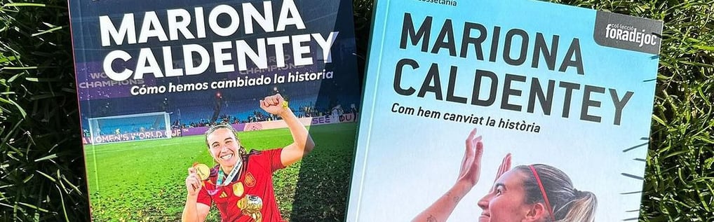 two books on the grass with a soccer player