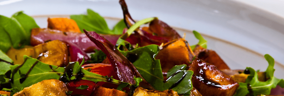 a bowl of balsamic roasted vegetables and bread