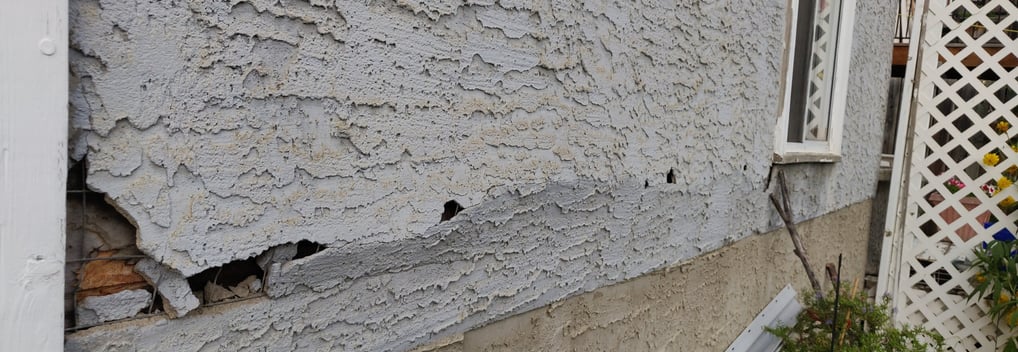 BULGING CRACKING PEELING OF STUCCO