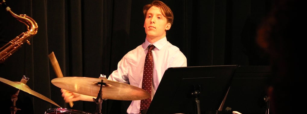 Aiden Schram, Drummer, playing the drums.