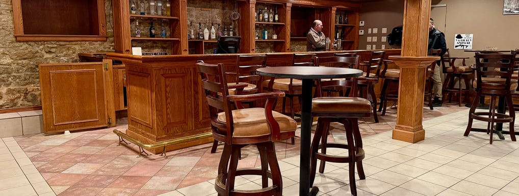 a bar with a bar stools near Decorah