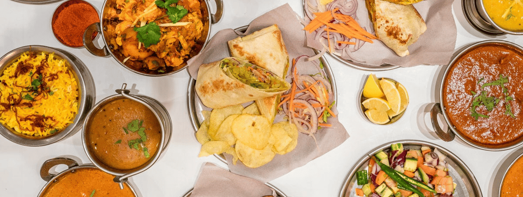 a table with many different types of food and drinks